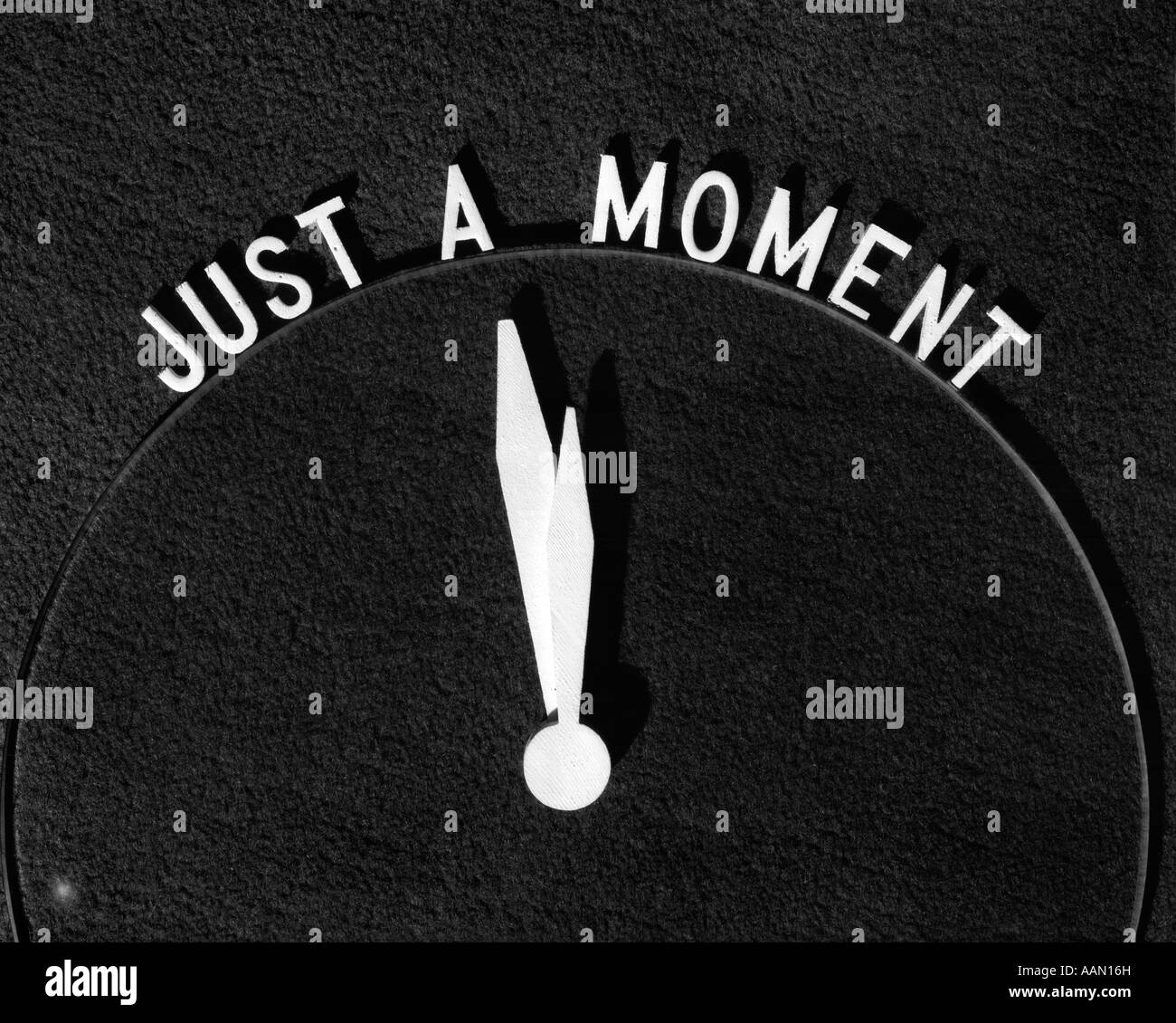 Sign just a moment clock hi-res stock photography and images - Alamy