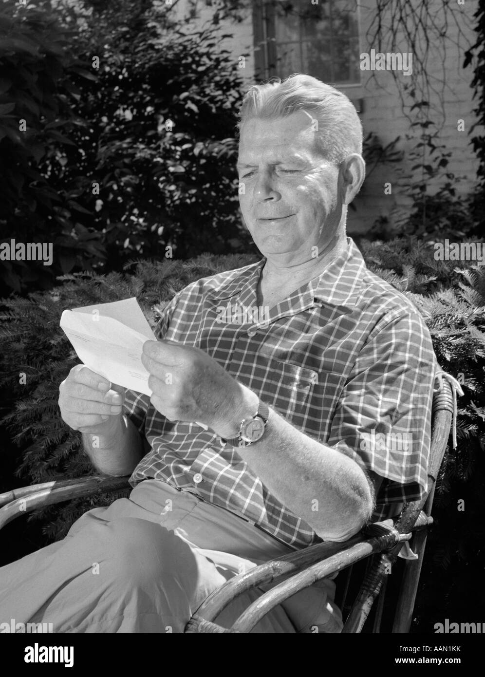 Outdoor rattan black chair Black and White Stock Photos & Images - Alamy