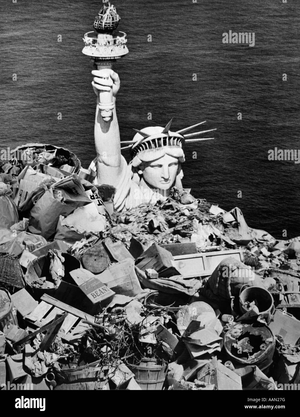 1970s COMPOSITE IMAGE STATUE OF LIBERTY BURIED IN GARBAGE Stock Photo