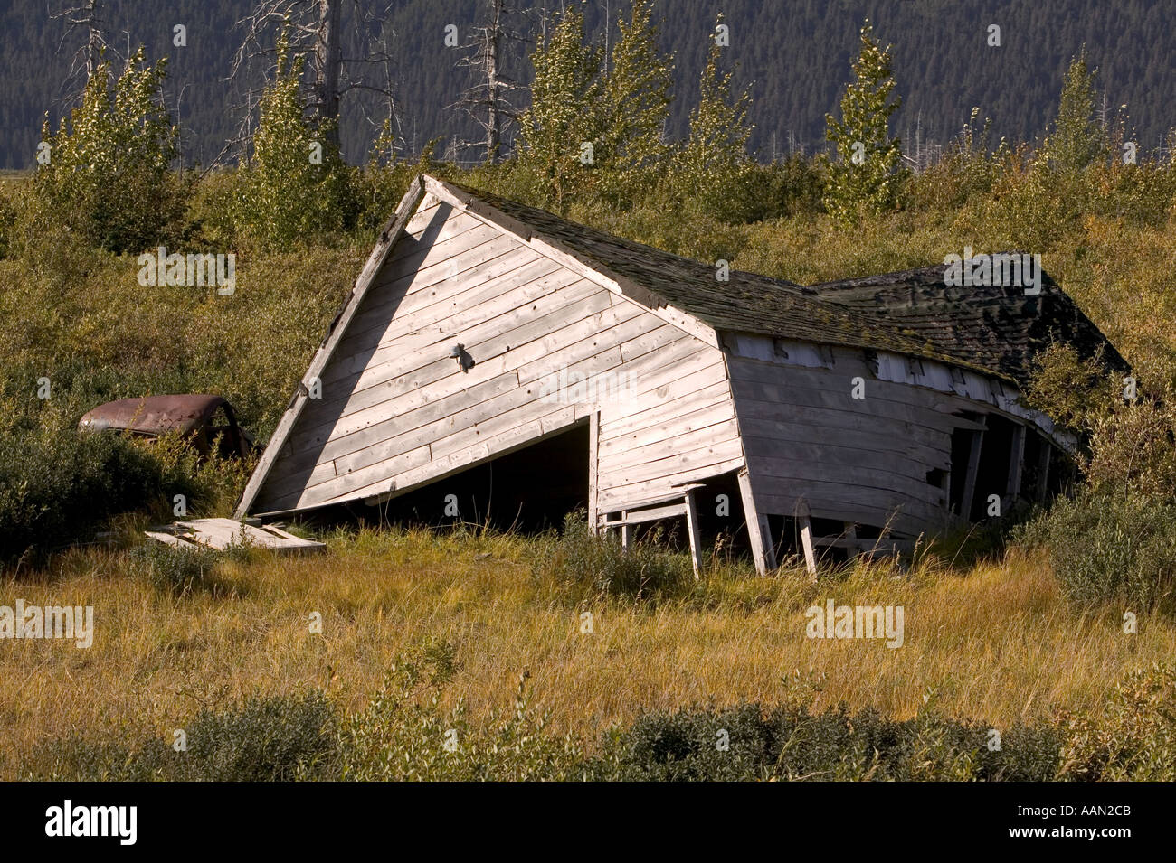 House collapsed in alaska due to melting permafrost caused by globalwarming Stock Photo