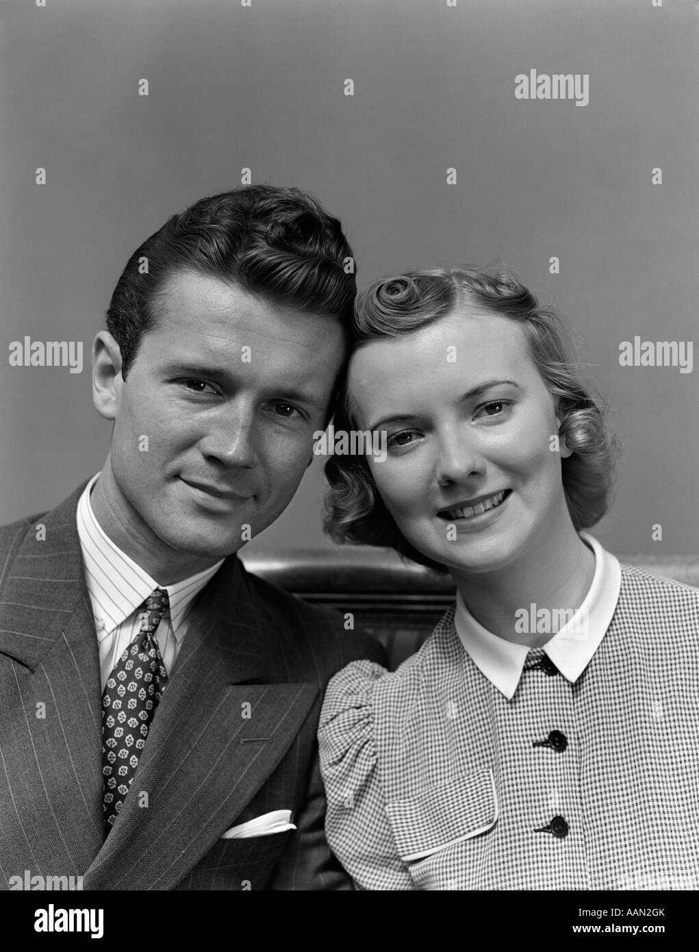 1930s 1940s PORTRAIT OF COUPLE LOOKING AT CAMERA Stock Photo