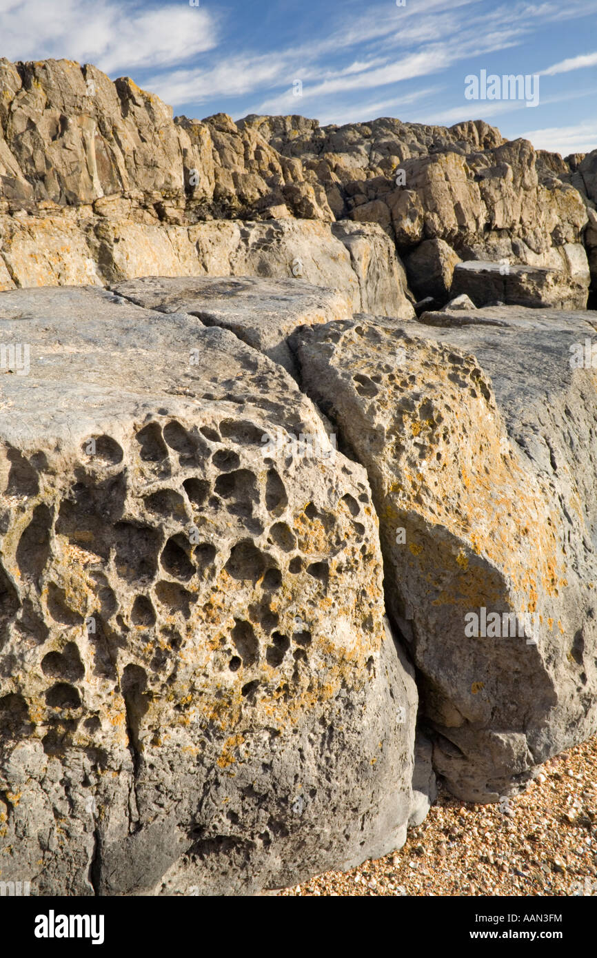 Eroded rock on Bamburgh Beach Northumberland England Stock Photo - Alamy