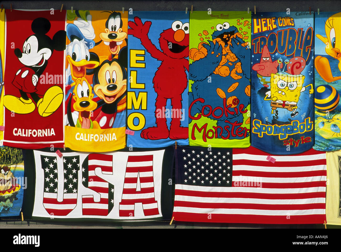Familiar characters on these colorful beach towels in a shop window near Venice Beach, Venice, California Stock Photo