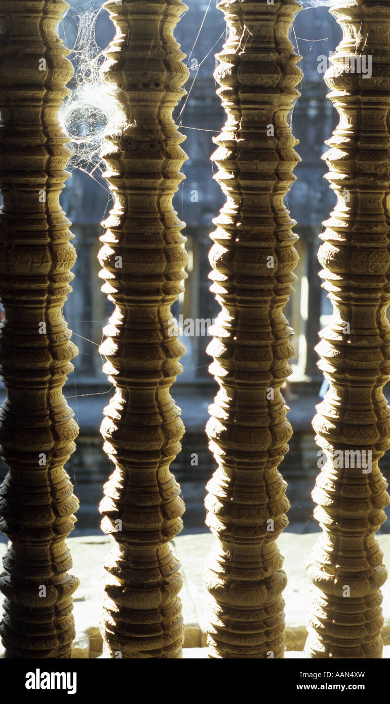Cobweb on the carved stone window balusters of the cruciform cloister ...