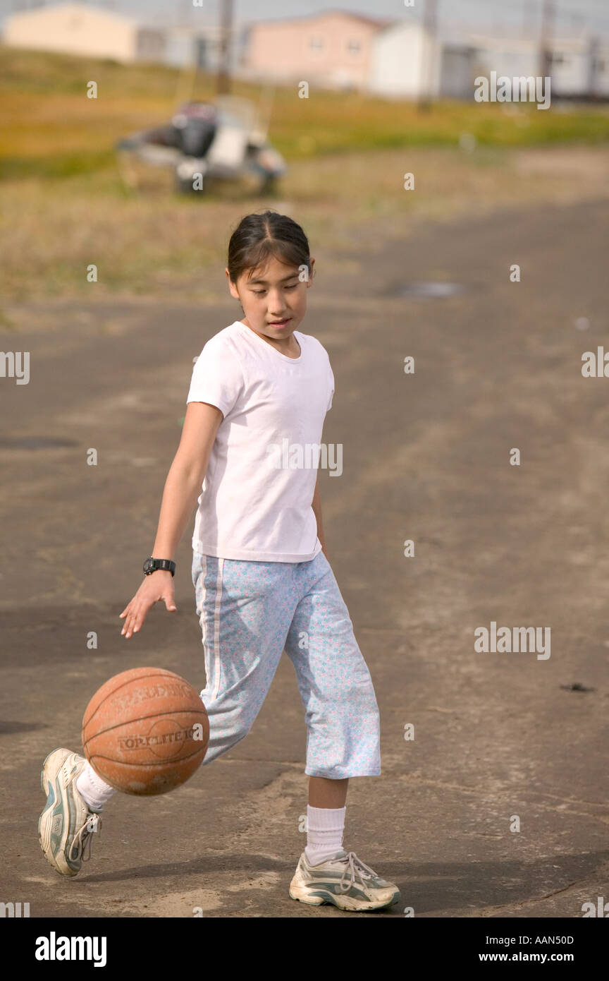 Emma Weyiouanna an eskimo child playing basket ball on the island