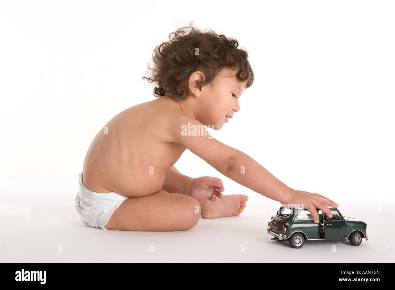 Little boy playing with toy car on the floor Stock Photo - Alamy