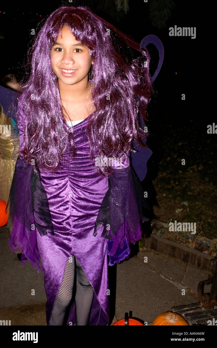 Halloween trick or treater in Purple costume and hair age 12. St Paul