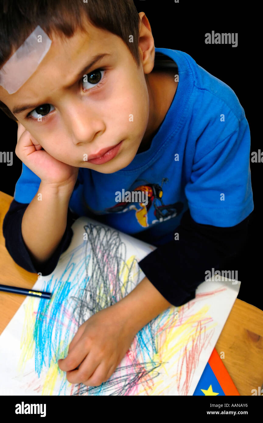 A disappointed child during play time Stock Photo