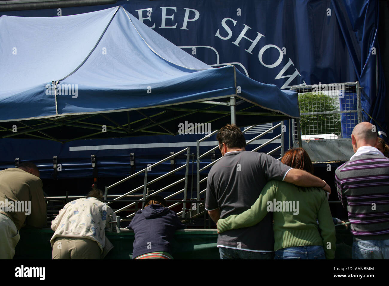 Visitors at the Sheep show enclosure, Suffolk Show, England UK Stock Photo