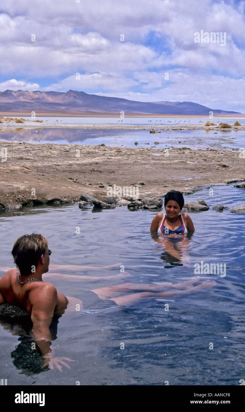 Tourists enjoying the hot spring in the Altiplano, Bolivia Stock Photo