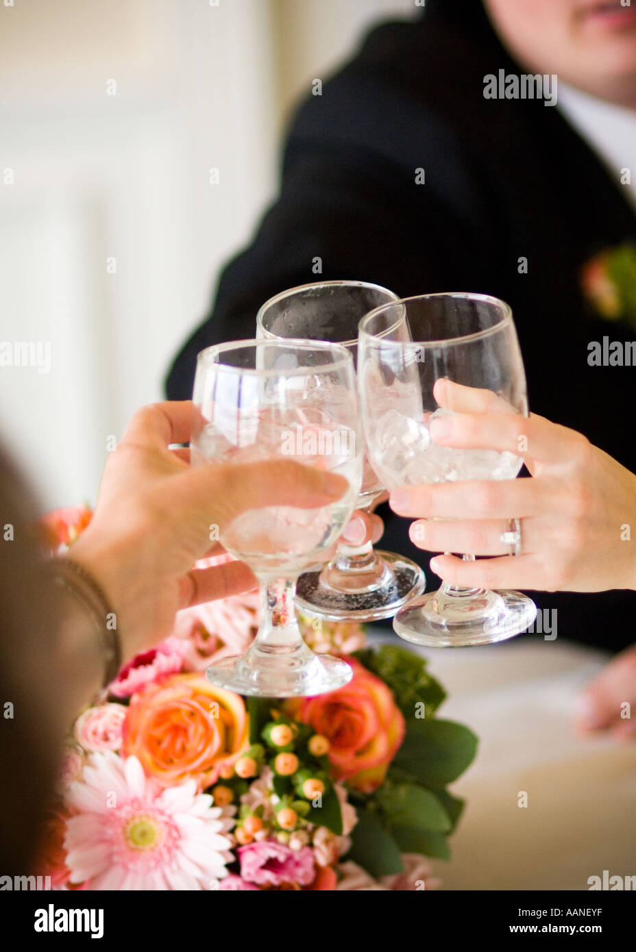 toasting with glasses of ice water Stock Photo