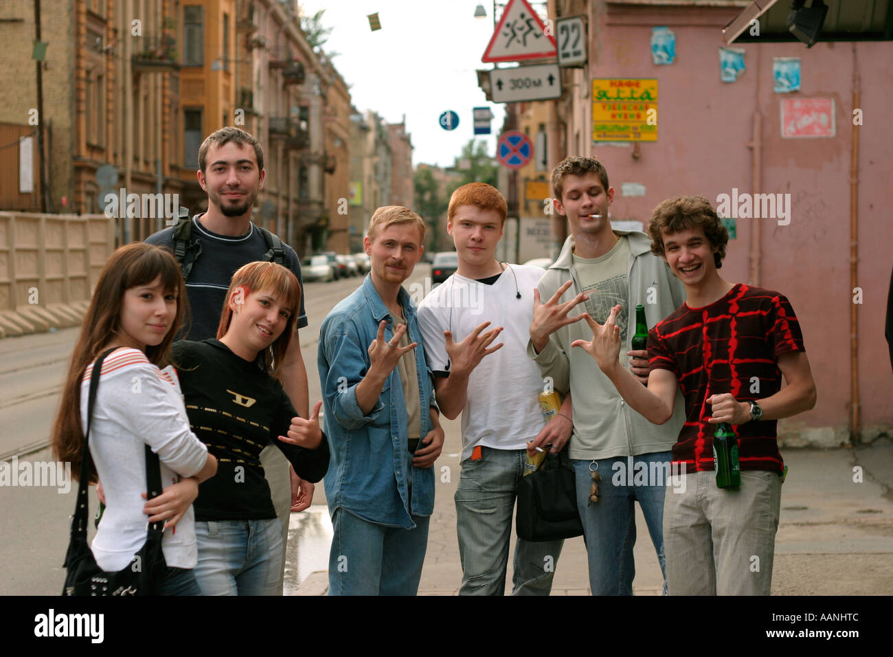 Group of young Russians having a good time , showing westside ' W ' finger sign . Saint Petersburg , Russia Stock Photo