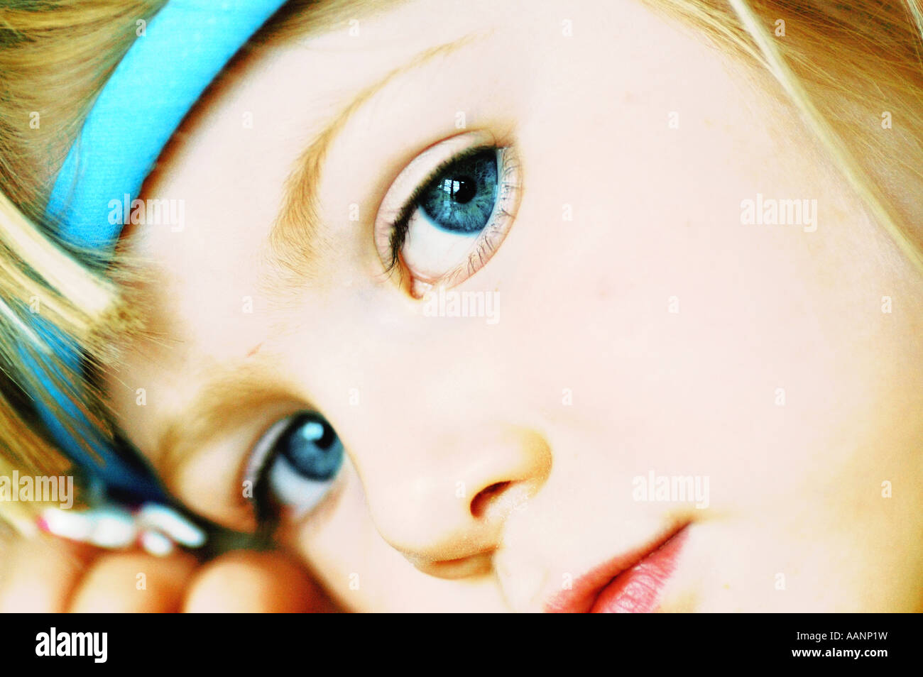 Tightly cropped cross-processed face of young child Stock Photo - Alamy