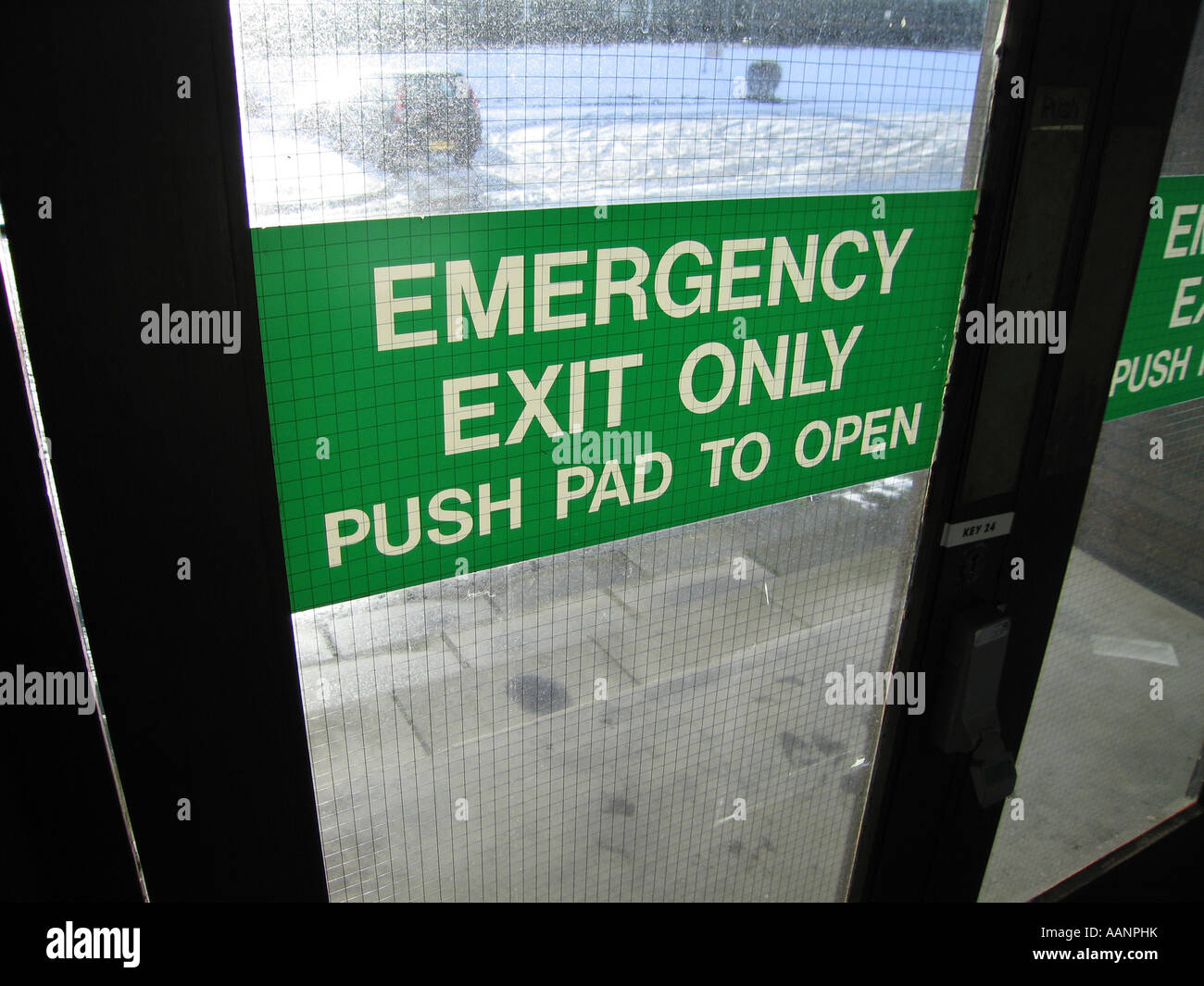 Emergency exit sign on glass door Stock Photo 12673902 Alamy