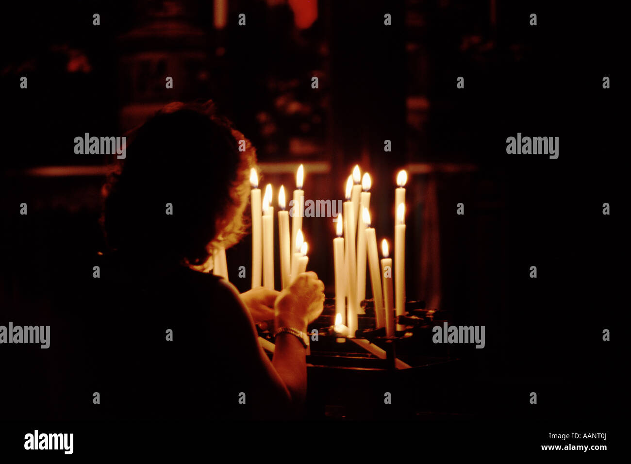 Lighting candles in the Basilica di S. Marco, St. Marks Square, Venice