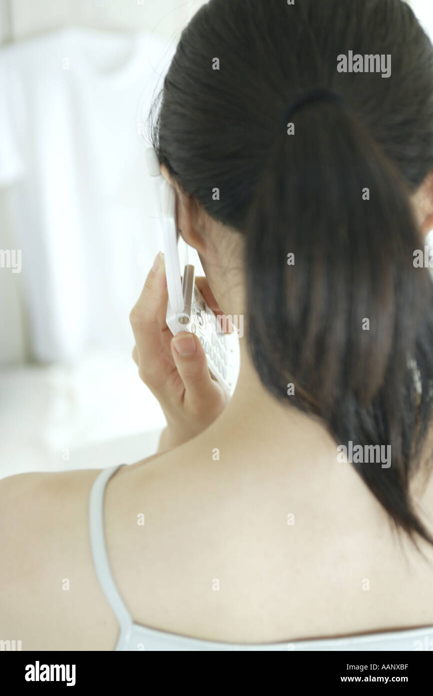 Woman talking one phone rear view hi-res stock photography and images ...