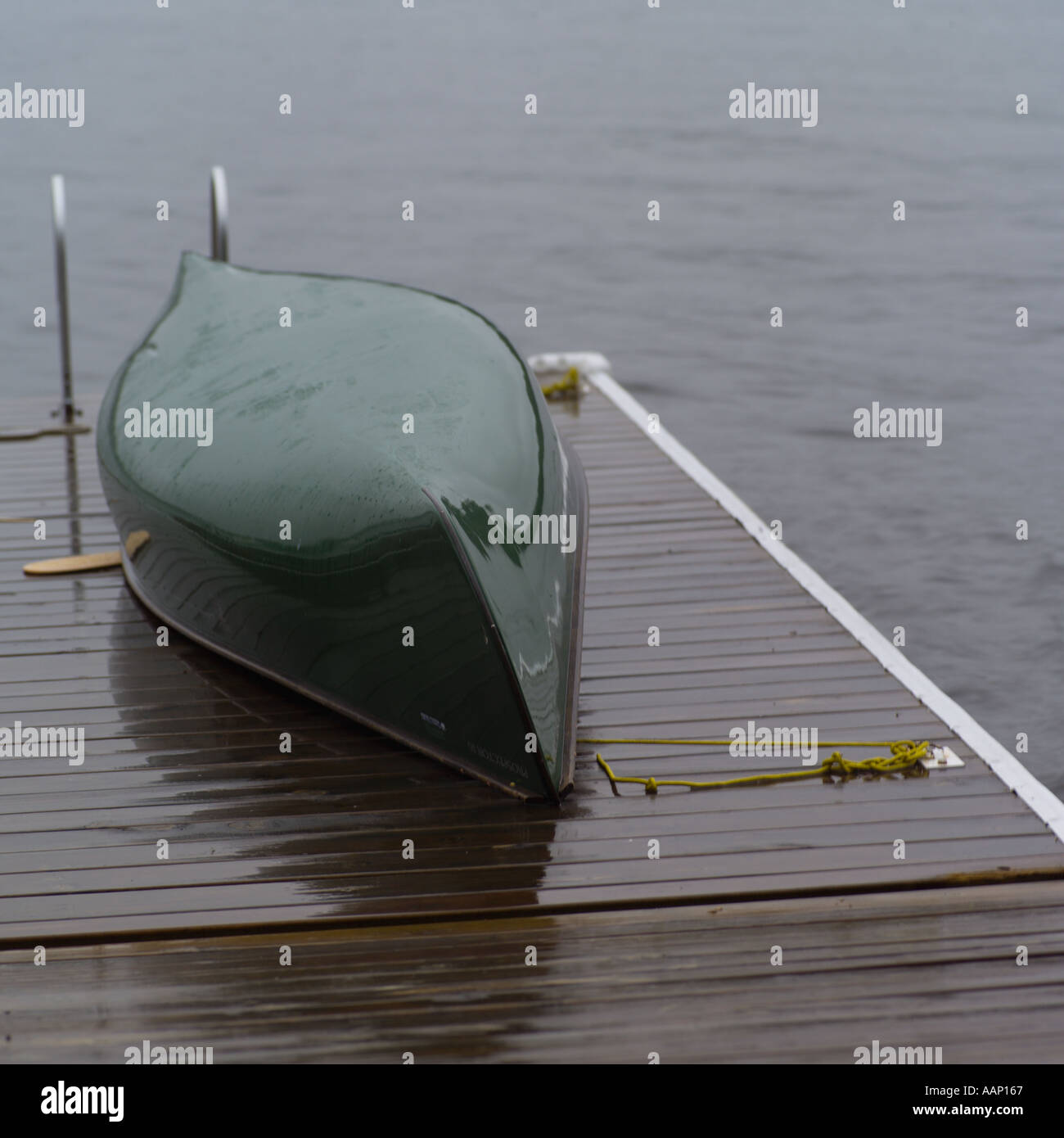 A canoe lying upside down on a pier Stock Photo Alamy