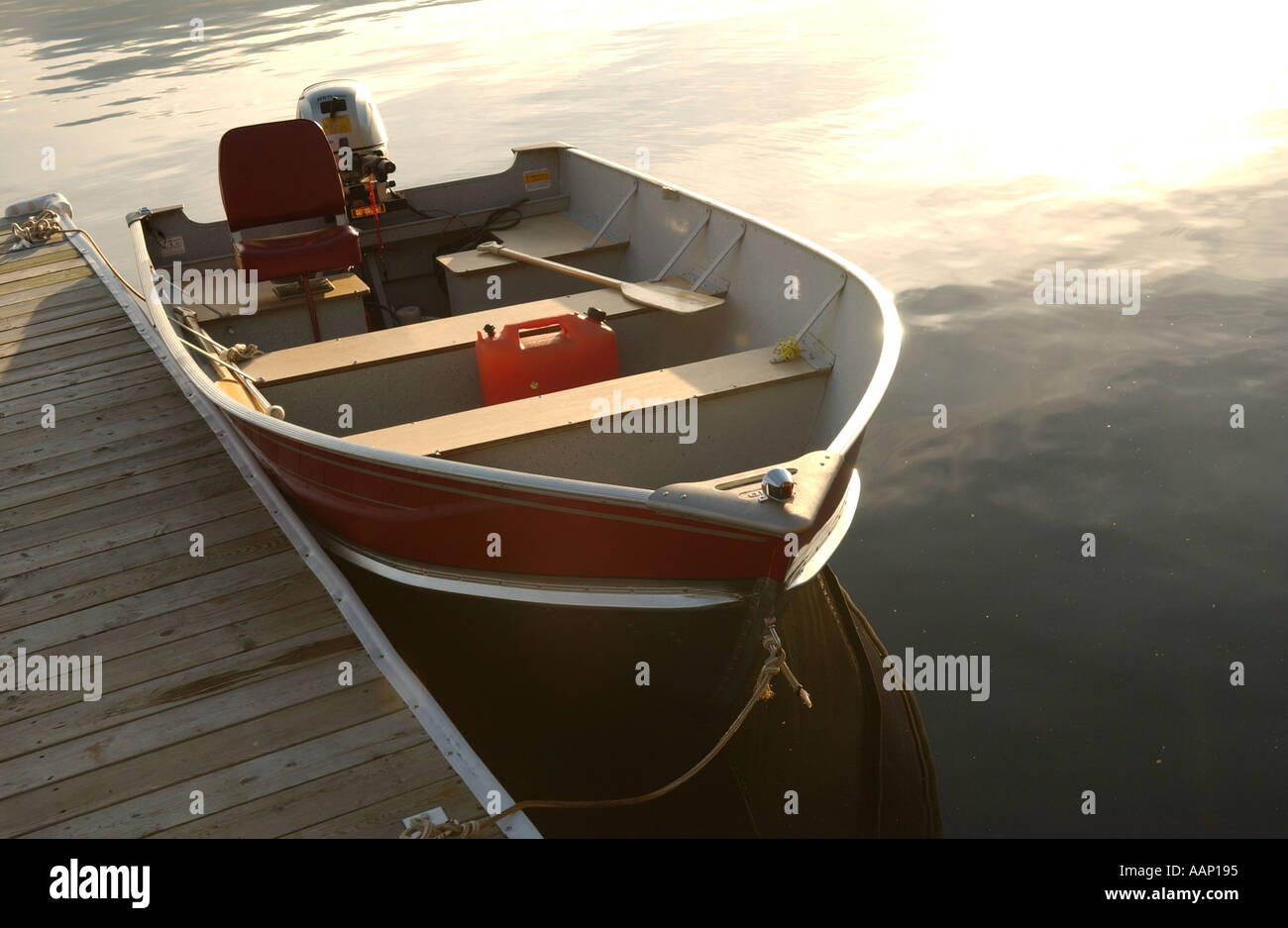 Motor boat tied to a pier at Lake of the woods Ontario Canada Stock ...
