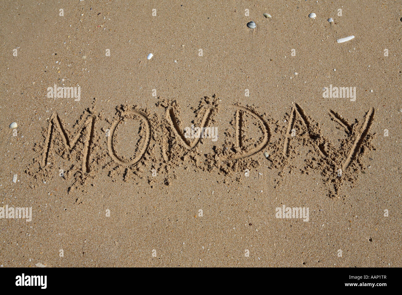 monday written on sand, weekdays Stock Photo
