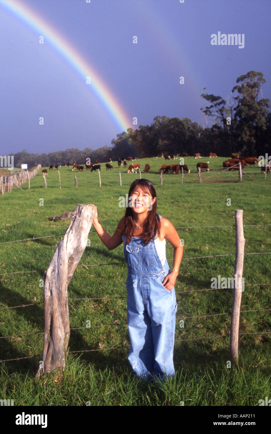 Girl rainbow HIO0016 A rainbow looks like rise up from the back of the cow Hawaii Maui Island Takaji Ochi V W Stock Photo
