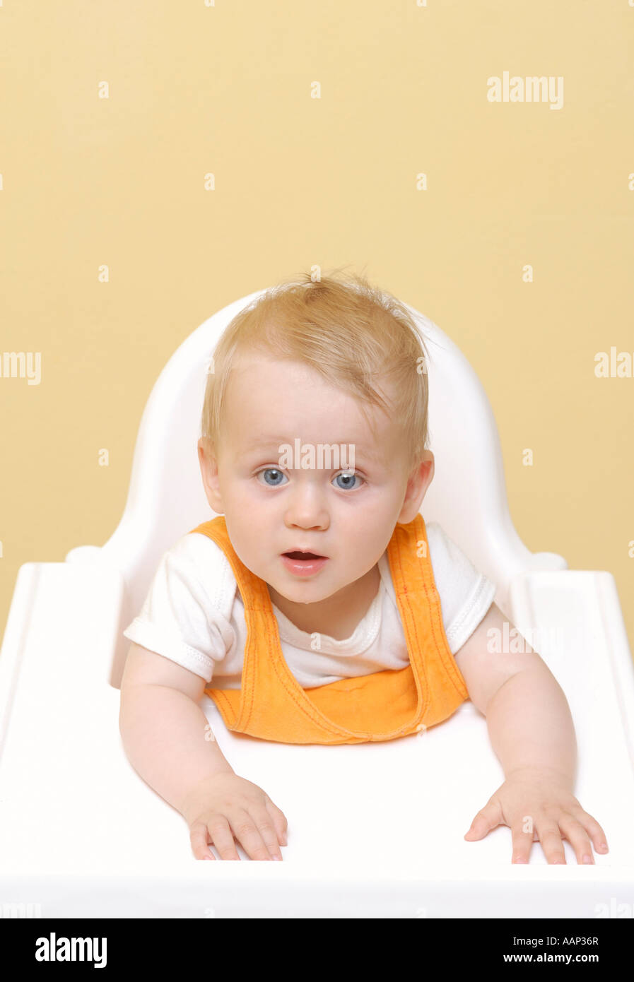 Baby in high chair Stock Photo Alamy