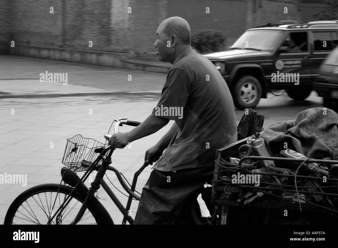 Chinese man riding bike under hires stock photography and images Alamy