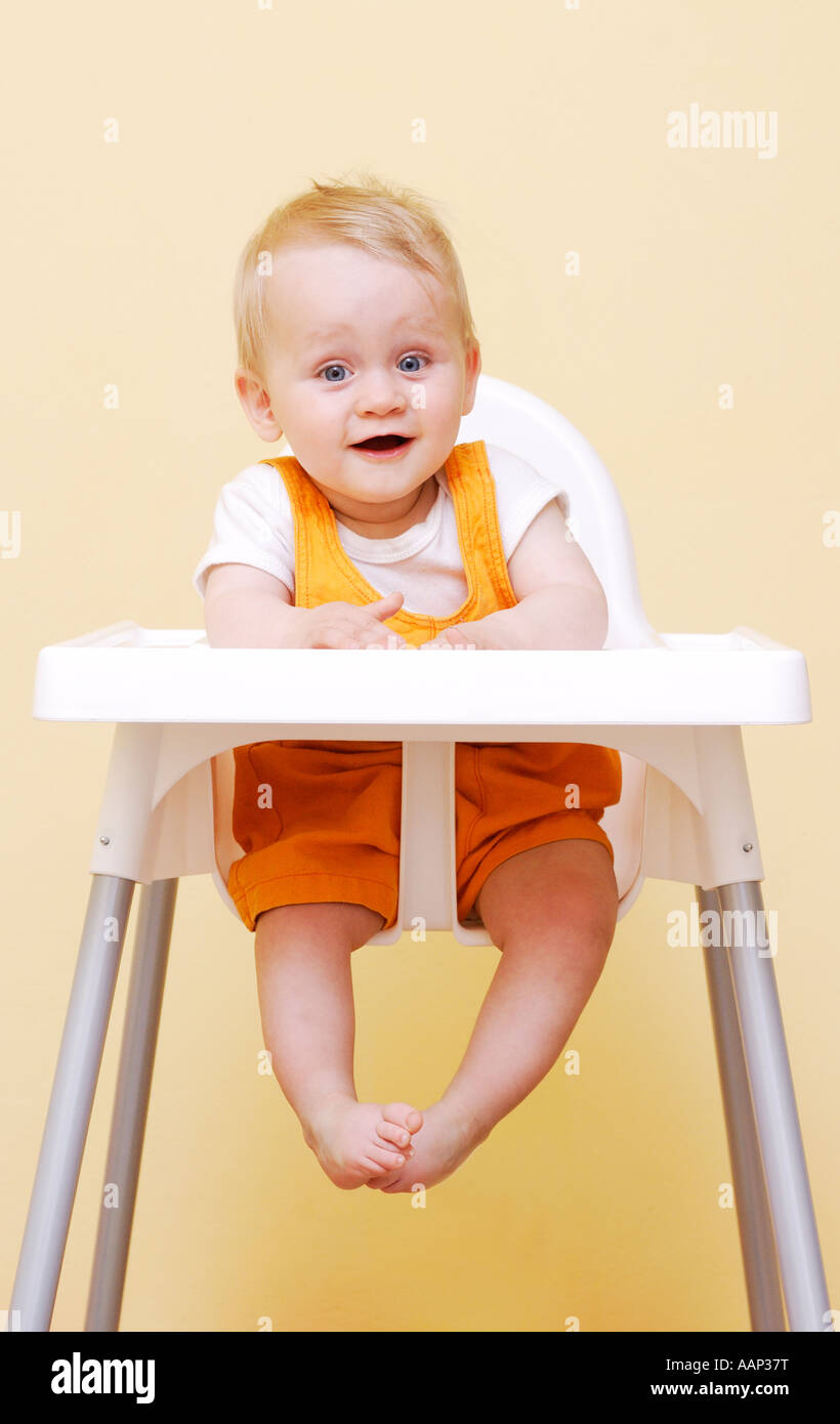 Baby in high chair Stock Photo Alamy
