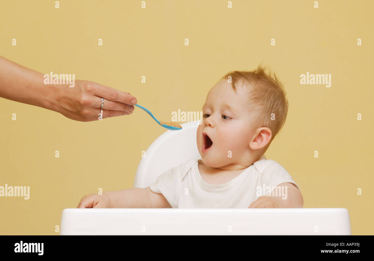 Baby in high chair Stock Photo Alamy