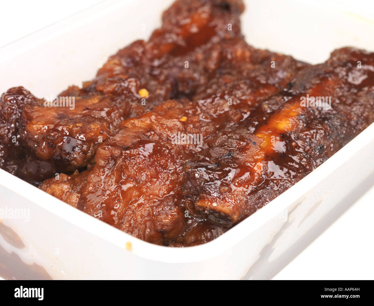 Chinese Barbeque BBQ Pork Ribs In A Spicy Sauce Takeaway Meal Isolated