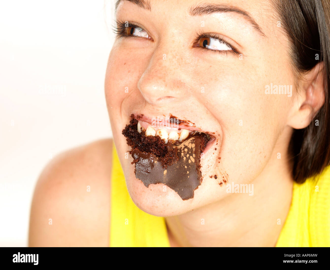 Young Woman Eating Chocolate Fudge Cake Model Released Stock Photo Alamy