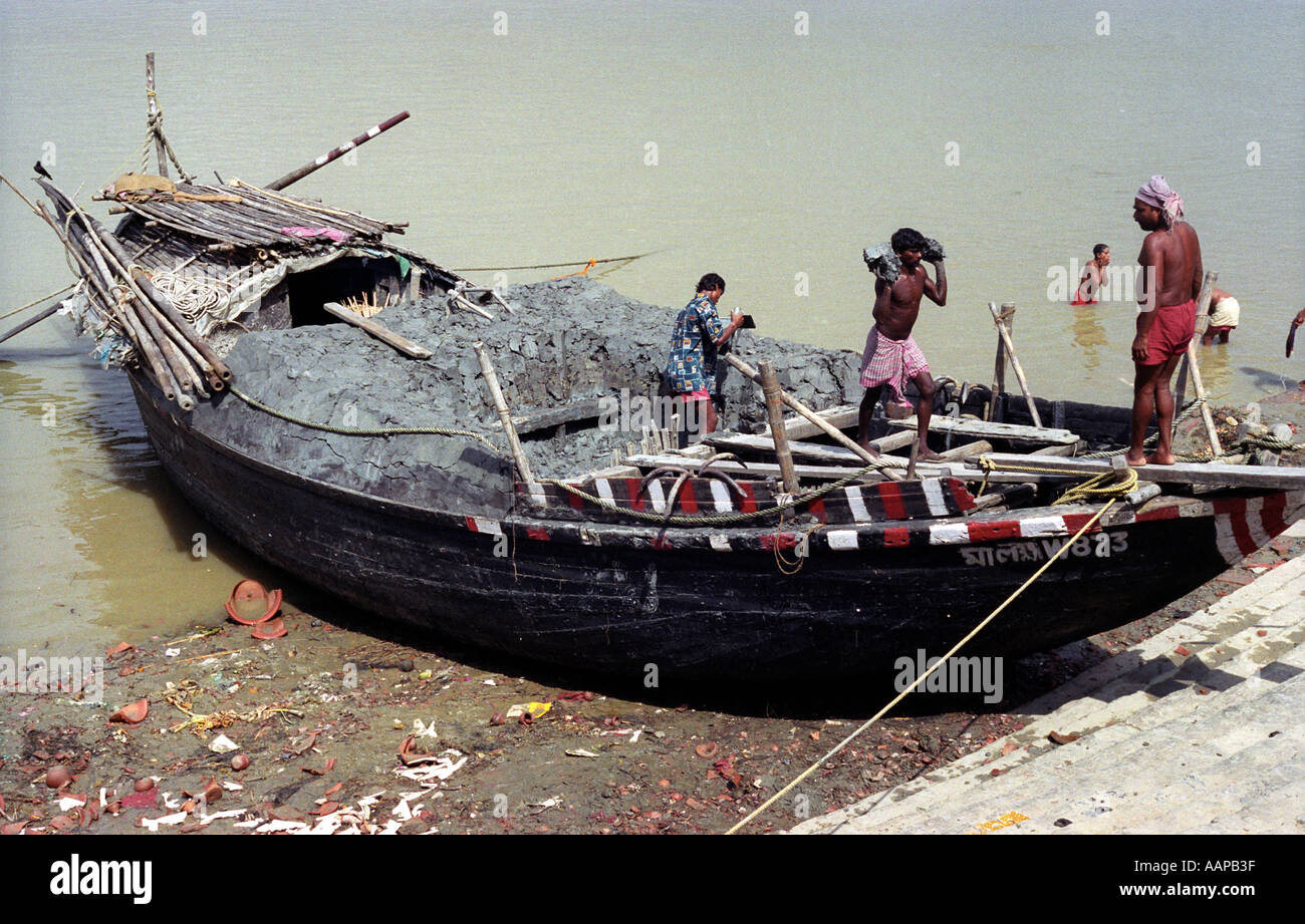 Boat laden with clay at the ghats Calcutta India Stock Photo Alamy