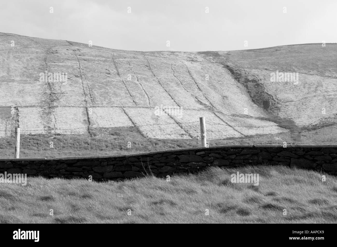 Graphic image of rock wall, fencing, fields and hills, Dingle peninsula, County Kerry, Republic of Ireland Stock Photo
