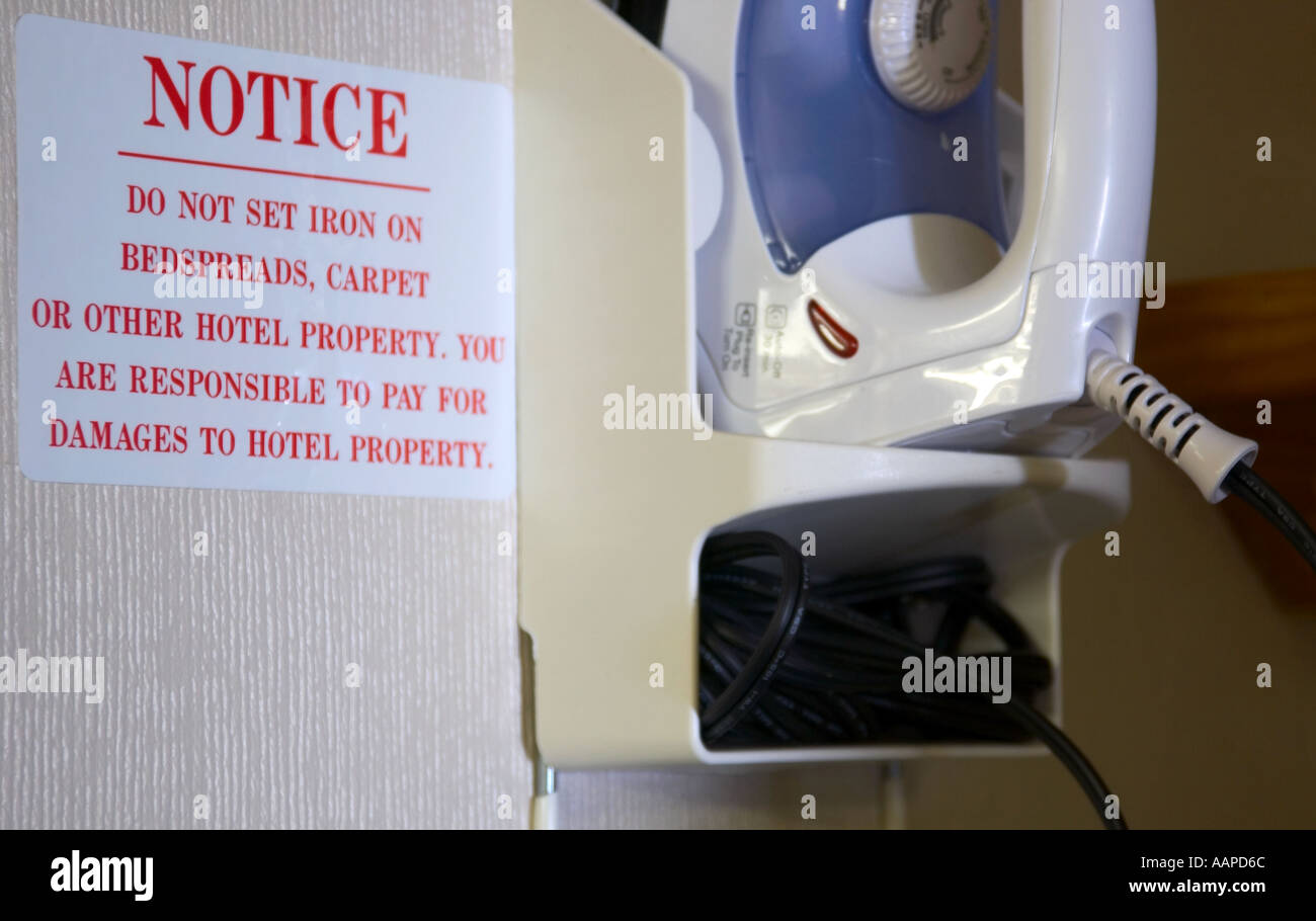 Notice beside iron in hotel warning of fire hazard. USA Stock Photo Alamy