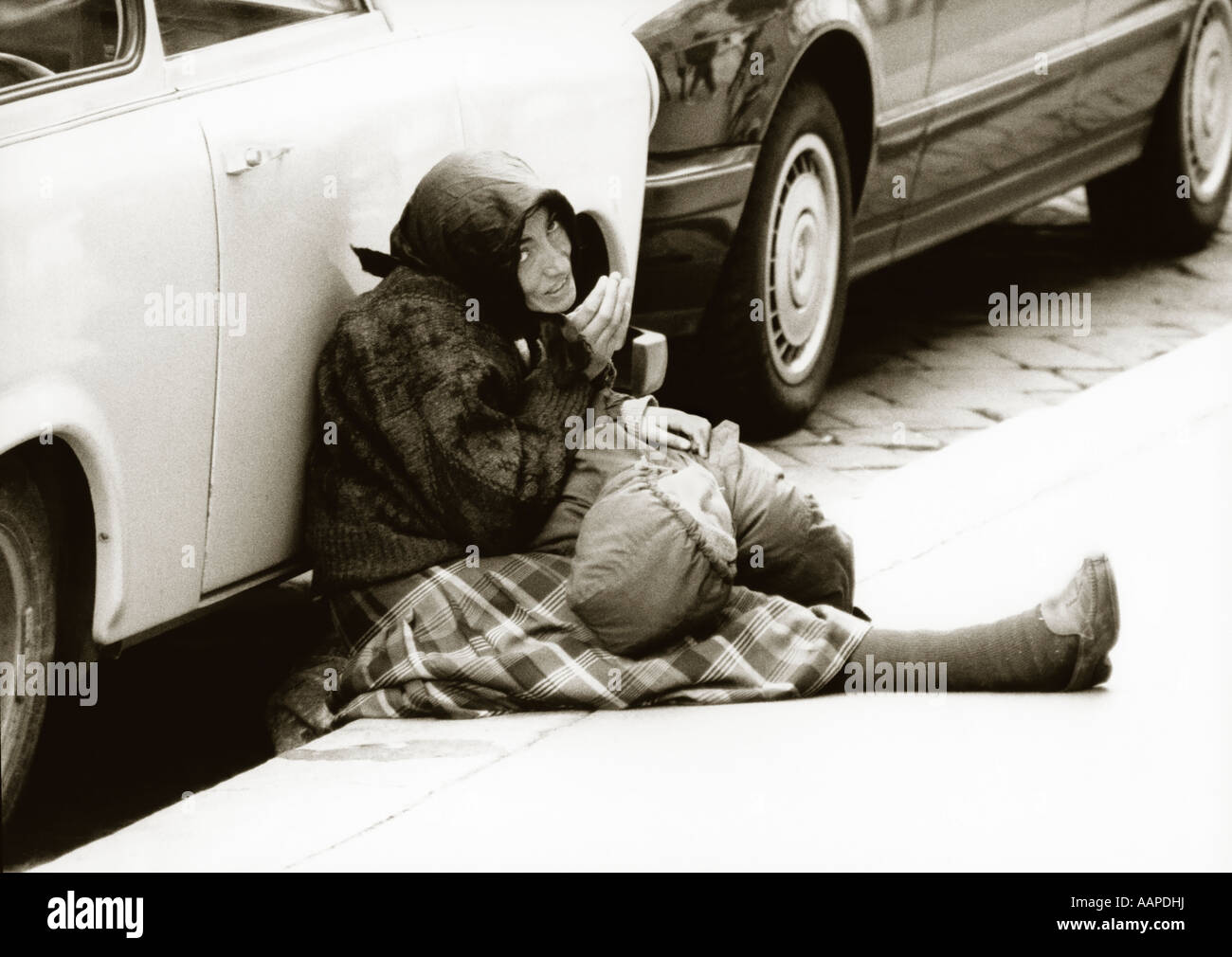 Woman begging with child. Stock Photo