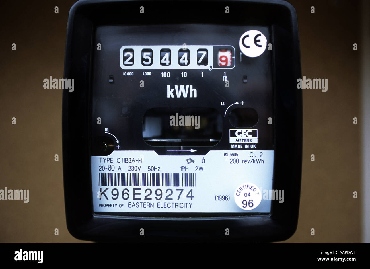 Domestic analogue electricity meter on the outside of a house in Ipswich, Suffolk, UK Stock