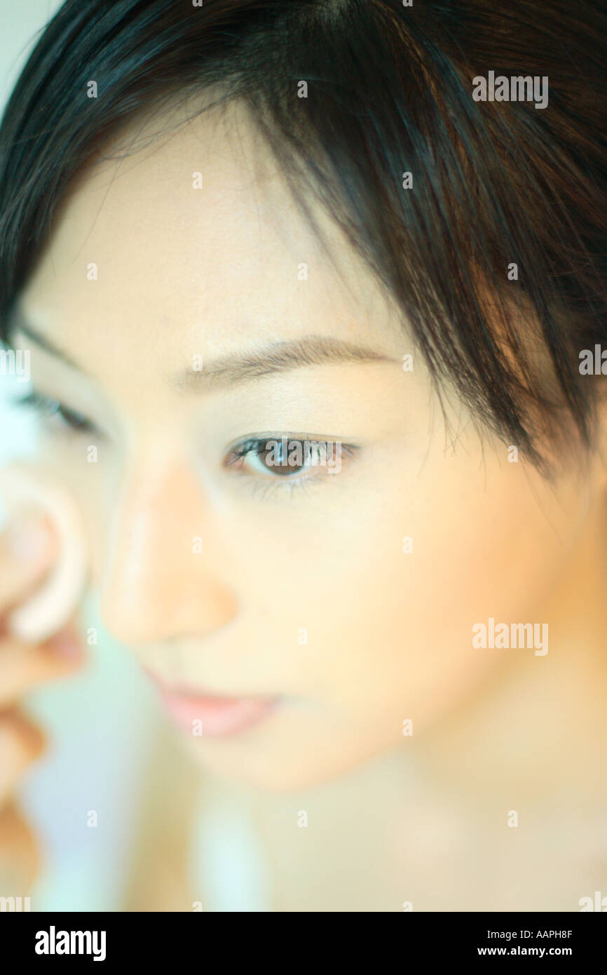 Woman applying foundation close up hi-res stock photography and images ...