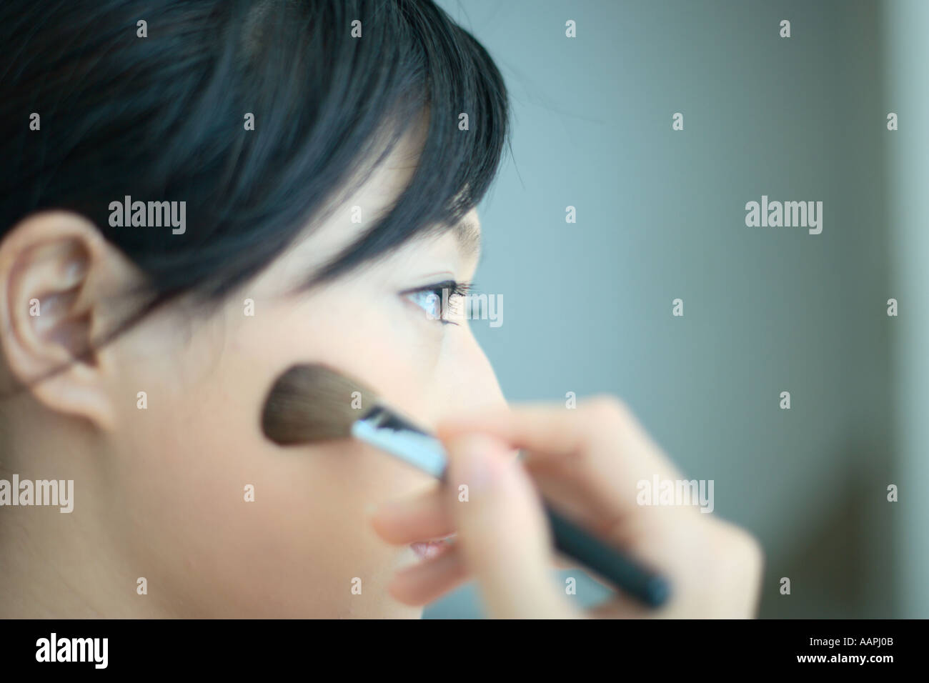 Asian woman applying blush hi-res stock photography and images - Alamy