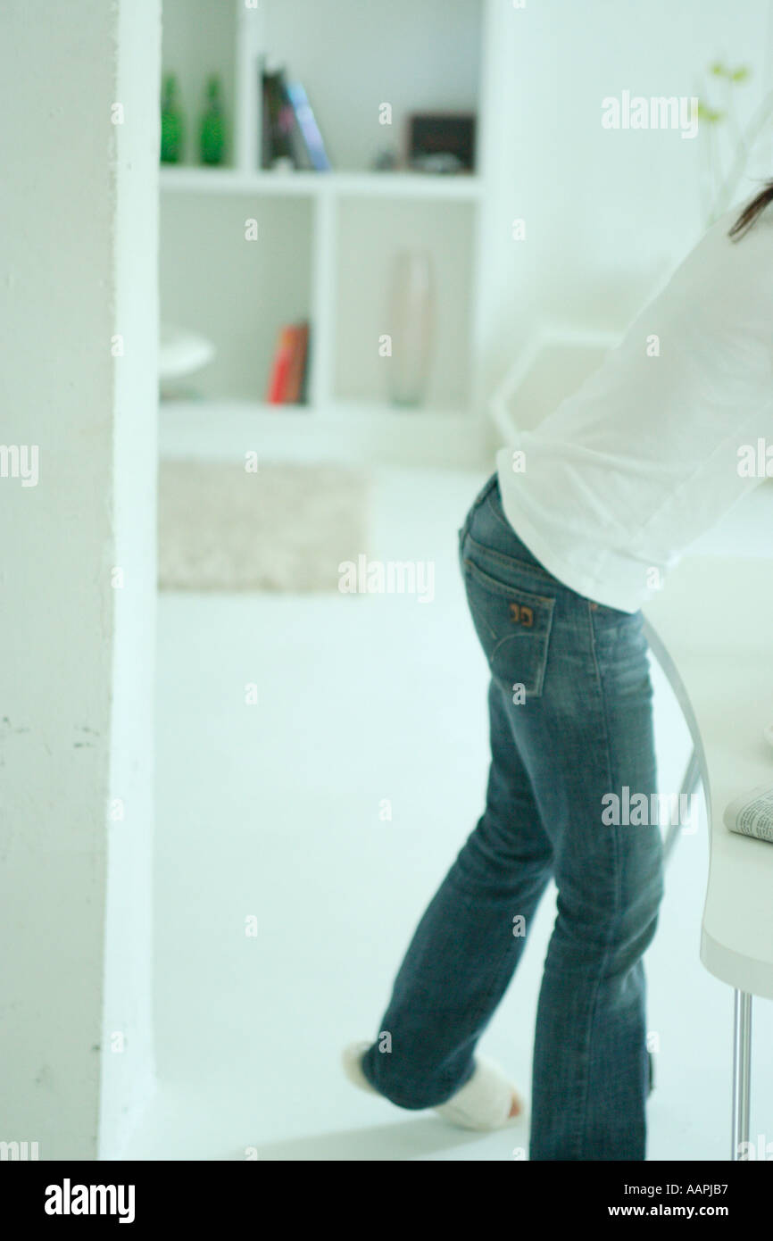 Unrecognizable woman in living room Stock Photo