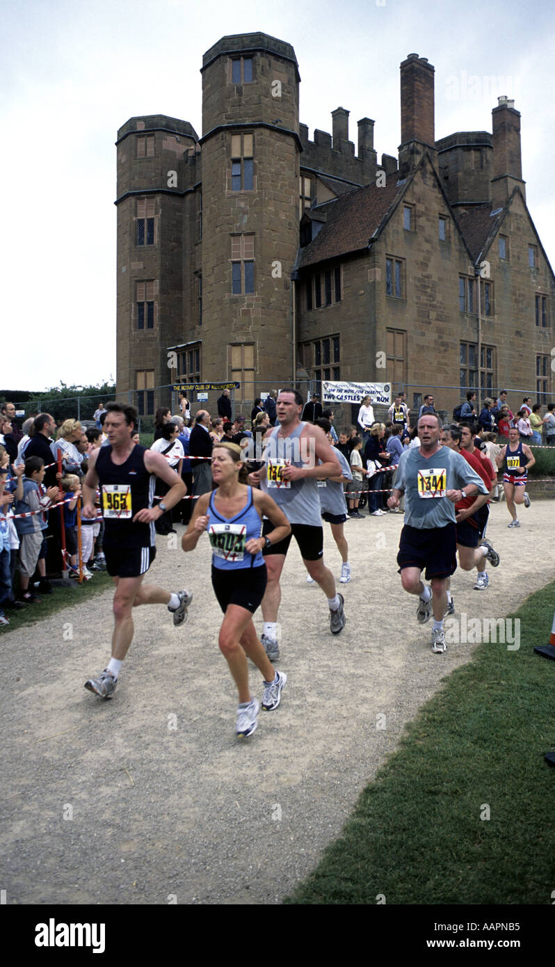 Runners finishing Two Castles 10k Run at Kenilworth Castle, Warwickshire, England, UK Stock Photo