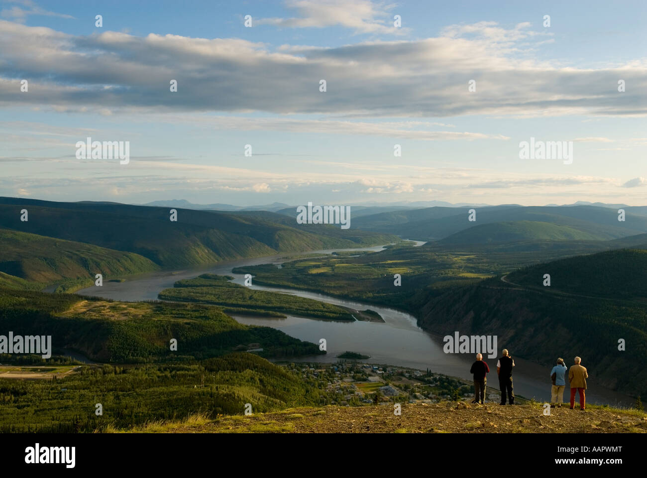 Tourists taking in the view from the Midnight Dome above Dawson City looking down to the Yukon River Stock Photo