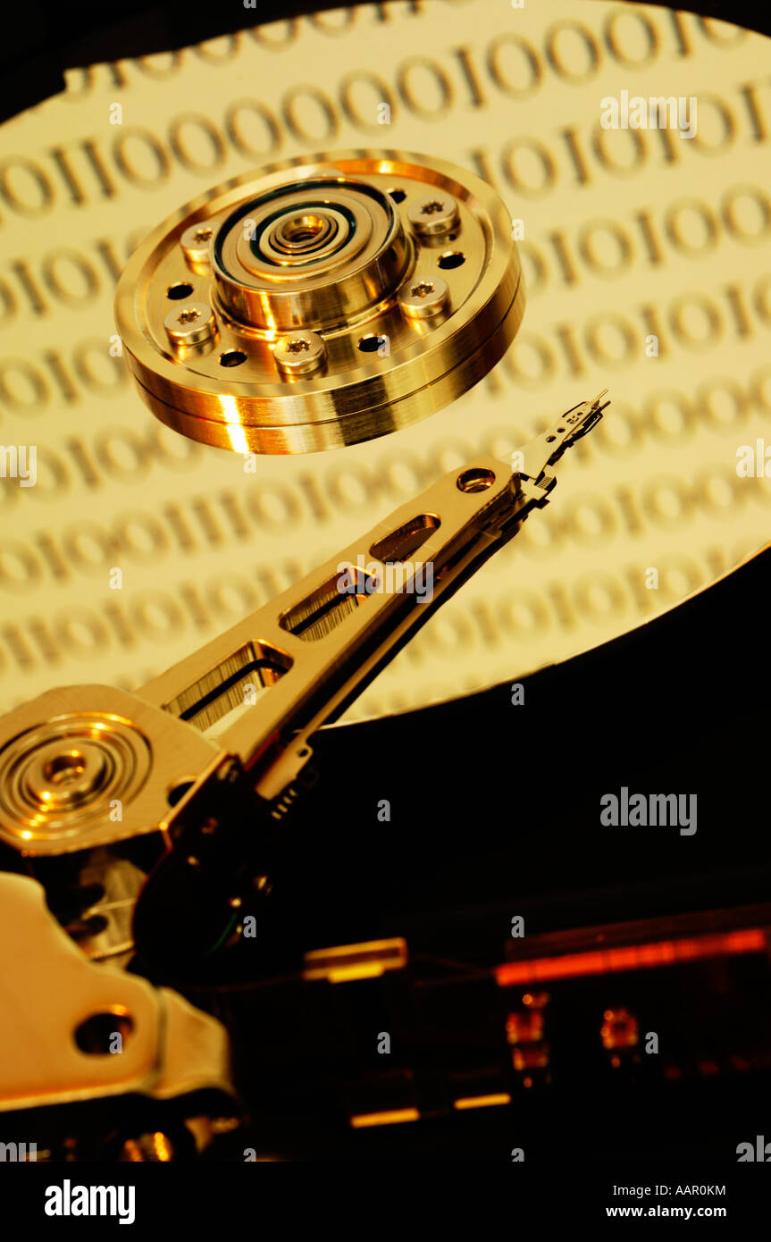 A computer hard disc exposed showing the magnetic disc platter, the ...