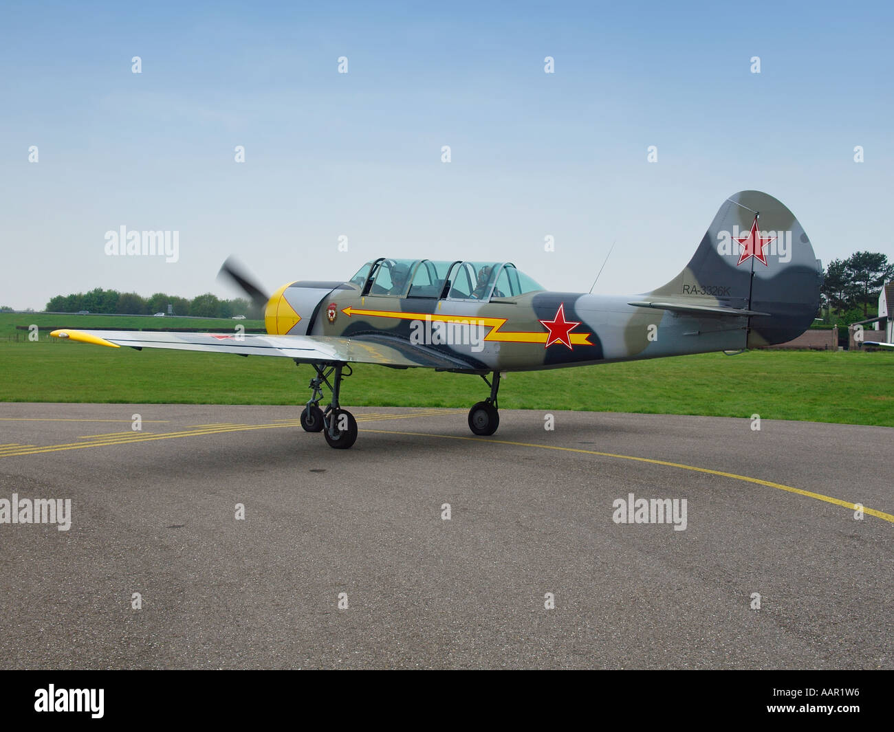 Taxiing Yakovlev Yak 52 Russian trainer aeroplane on Seppe airfield Noord Brabant the Netherlands Stock Photo