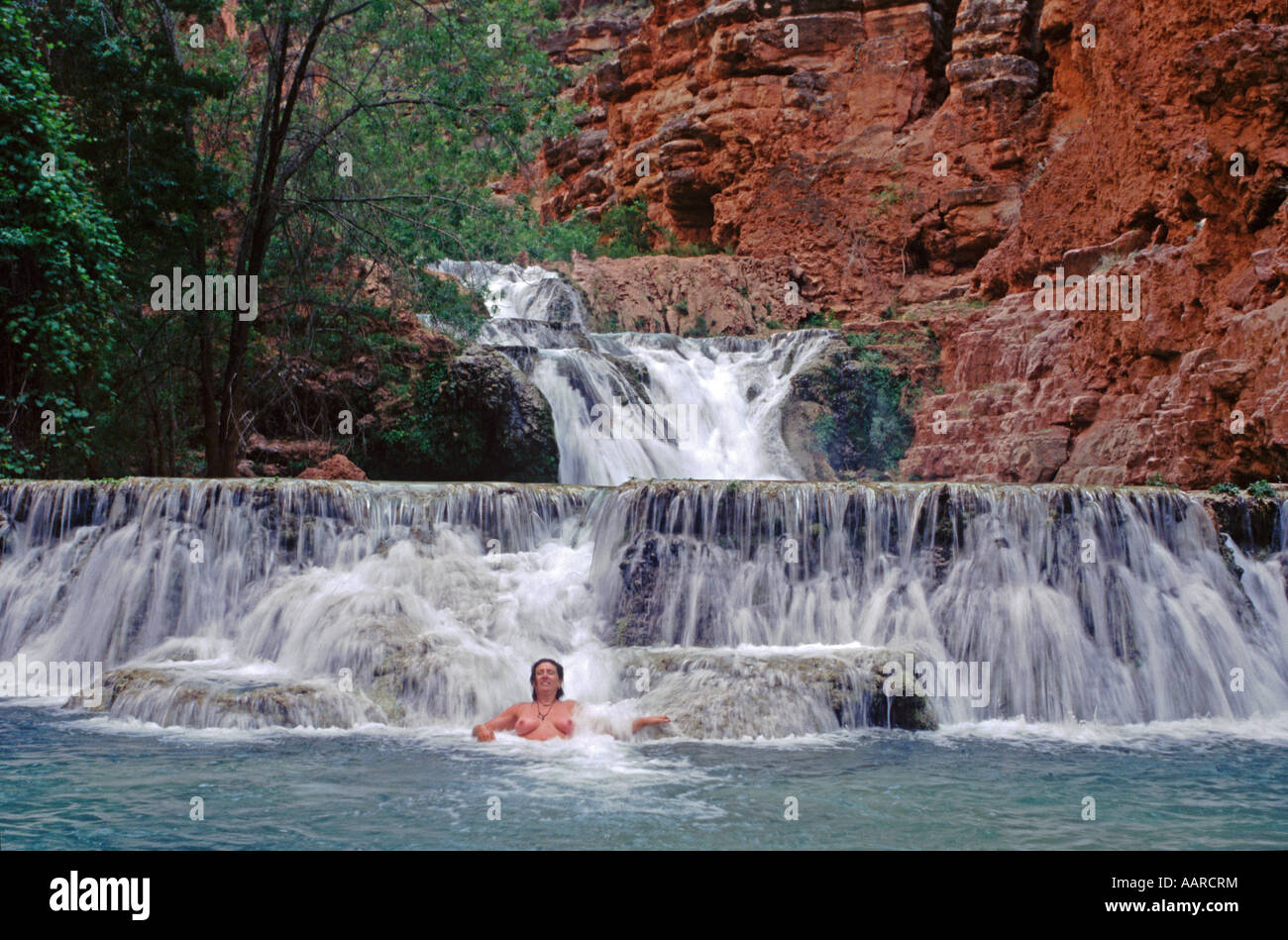 Christine swims below BEAVER FALLS along HAVASU CREEK GRAND CANYON NATIONAL PARK ARIZONA MR