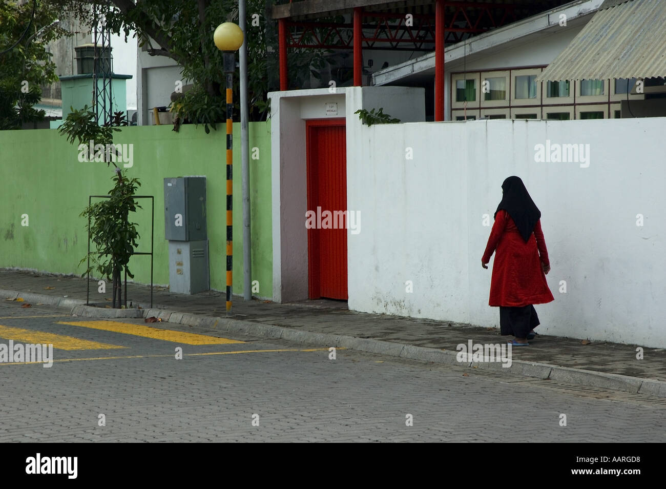 Maldives City Of Male A Woman Walking In The Street Stock Photo