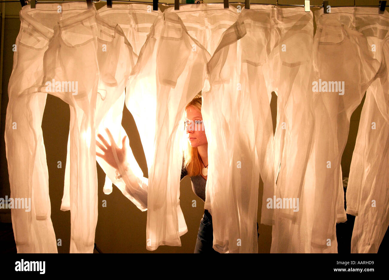 Clear Cut Project turns transparent jeans into art Stock Photo