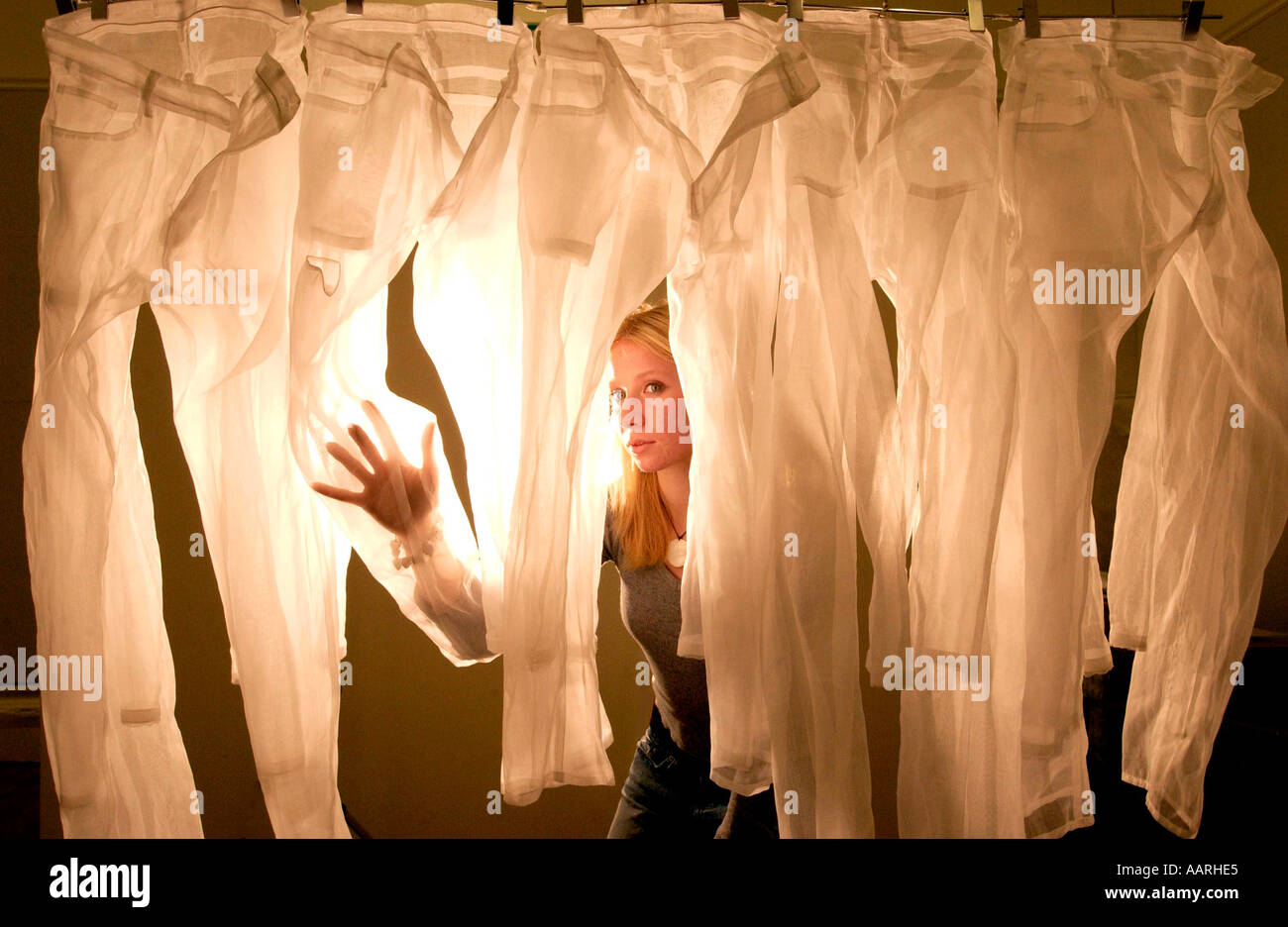 Clear Cut Project turns transparent jeans into art Stock Photo