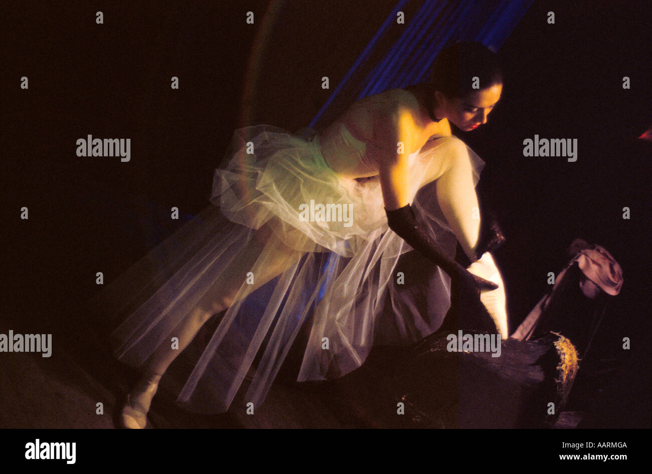 BOLSHOI THEATRE MOSCOW IRINA ZIBROVA A YOUNG CORPS DE BALLET DANCER BACKSTAGE TYING UP HER BALLET SHOE 1995 Stock Photo