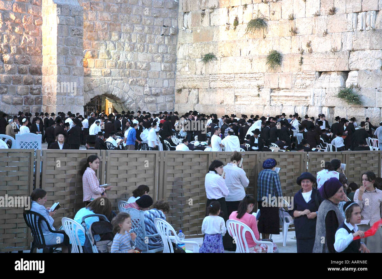 Jerusalem's Western Wall deeply sacred to religious Jews Men are separated from women by a simple fence Stock Photo