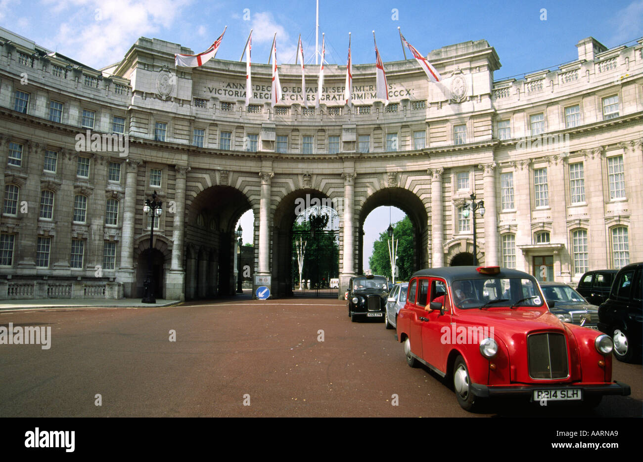 Red taxi at Admiralty Arch London Stock Photo