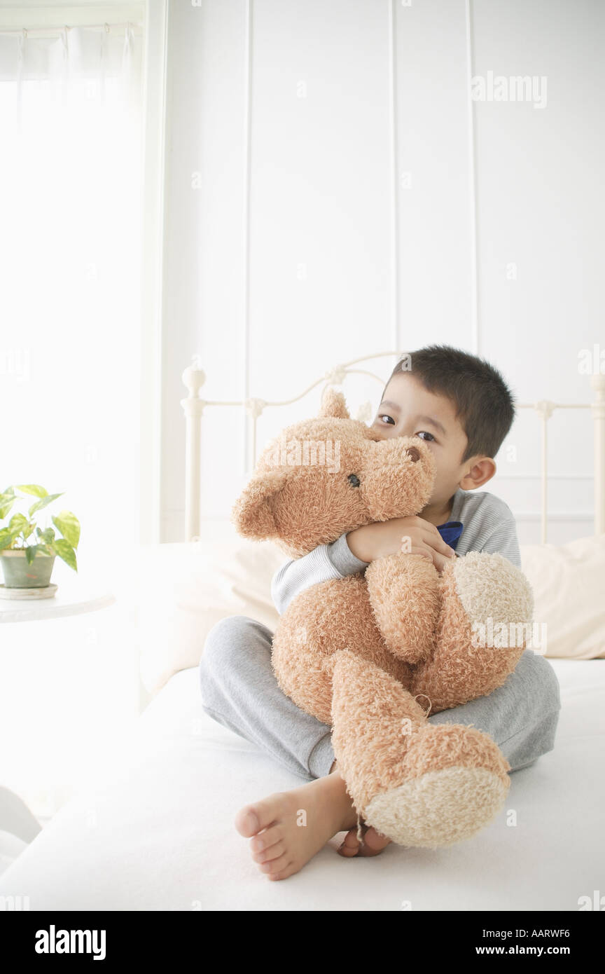holding a stuffed animal